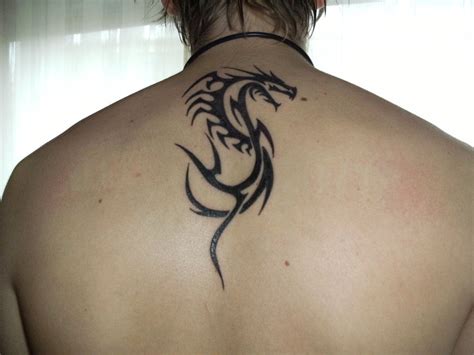 pretty dragon tattoos|tribal dragon tattoos for women.